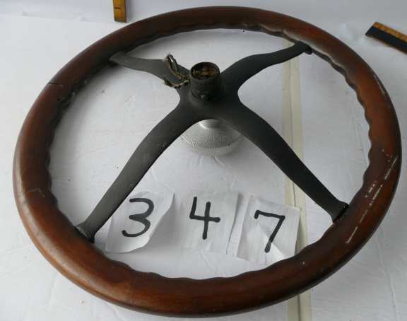 Oak wooden steering wheel from old car17” diameter. Horn wires attached.