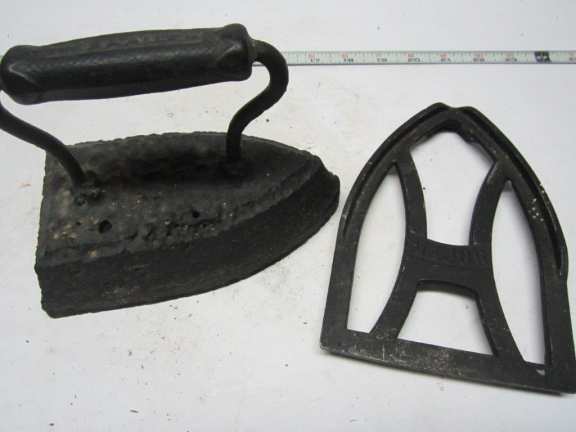 Primitive clothes iron with stand