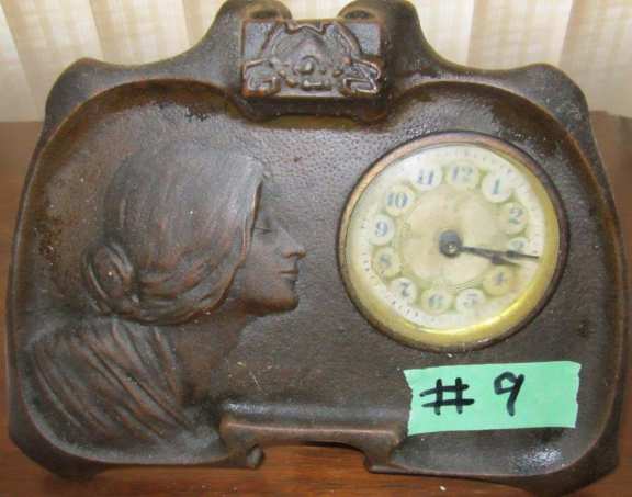 Bronze clock with picture of young lady