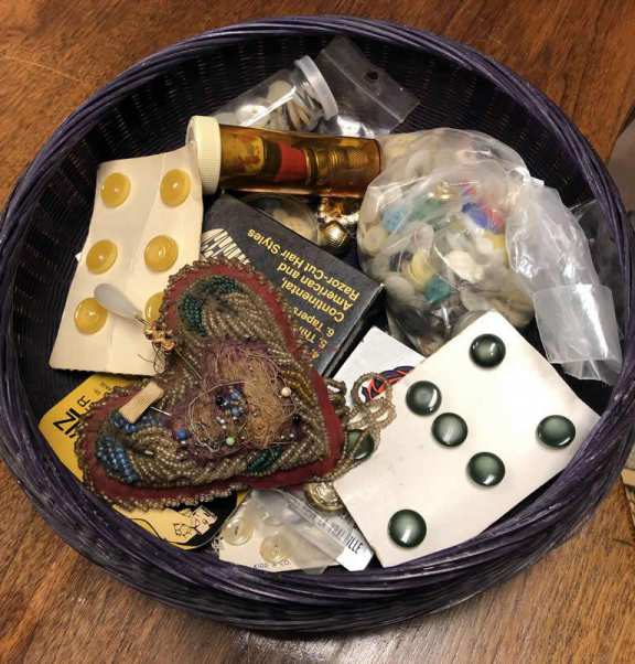 Old sewing basket with various contents