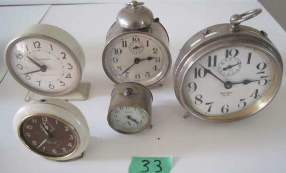 5 assorted alarm clocks