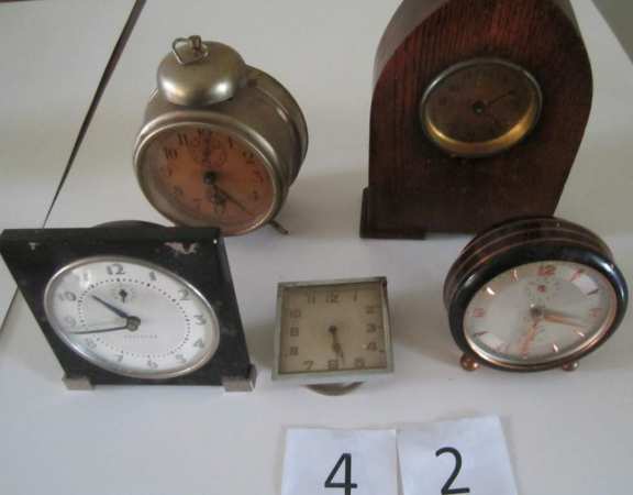 5 assorted alarm clocks