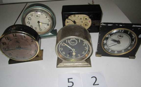 5 assorted alarm clocks