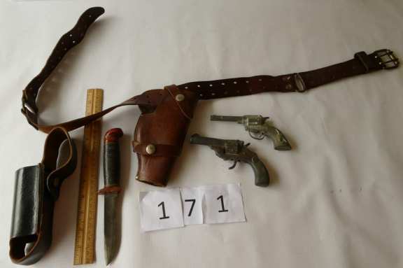 Leather holders and toy gun.